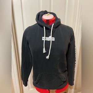 Black with some white details,Hollister Hoodie, Medium.